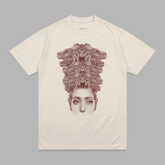T-shirt with stylized human face topped by a cluster of lion heads.