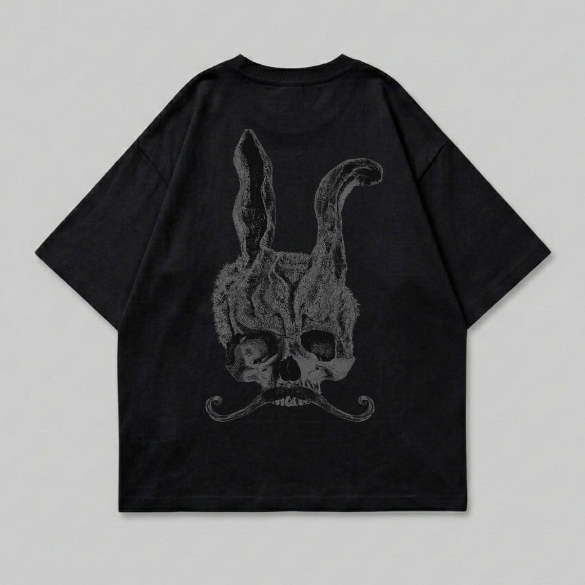 Black t-shirt with a skull, bunny ears, and mustache graphic.