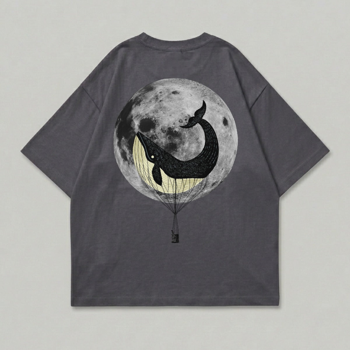 T-shirt with whale in hot air balloon against full moon.