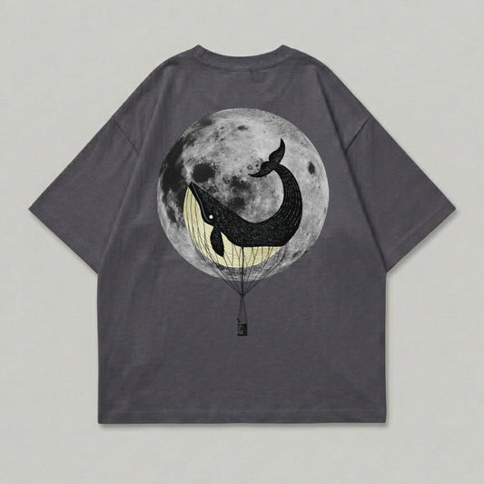 T-shirt with whale in hot air balloon against full moon.