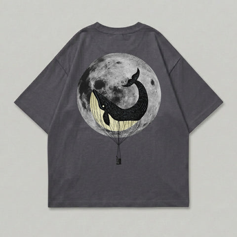 T-shirt with whale in hot air balloon against full moon.