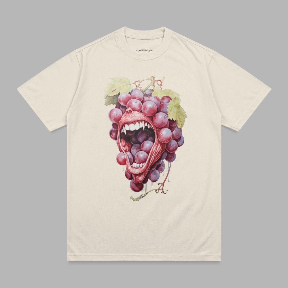 Cream t-shirt with graphic of screaming mouth emerging from bunch of grapes.