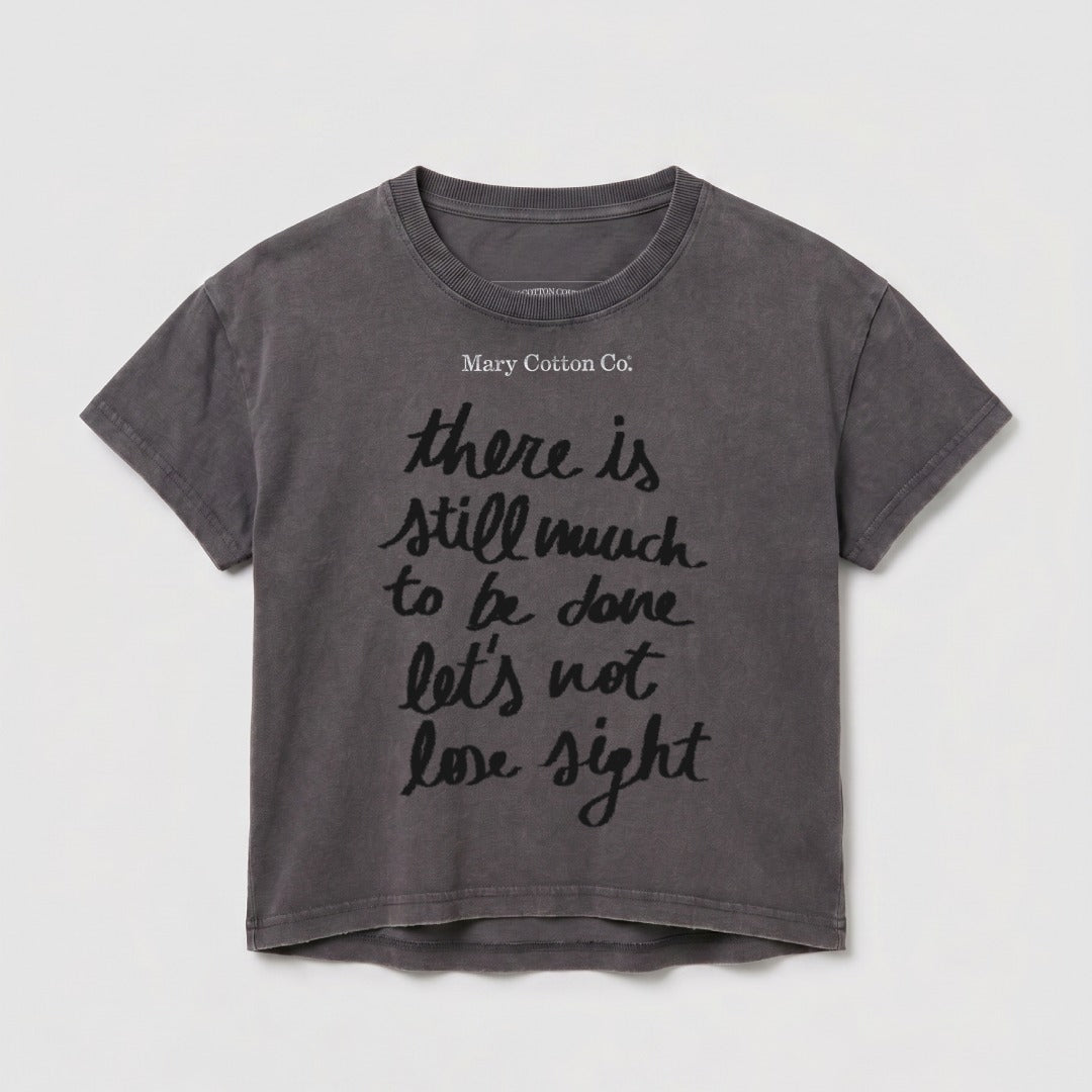 Gray t-shirt with "Mary Cotton Co." and quote "there is still much to be done let's not lose sight".