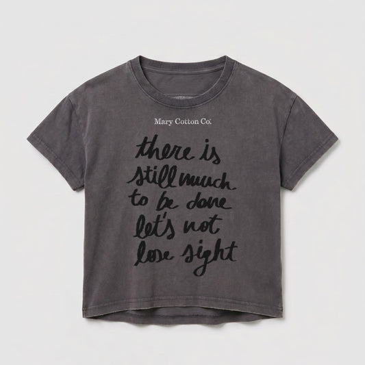 Gray t-shirt with "Mary Cotton Co." and quote "there is still much to be done let's not lose sight".