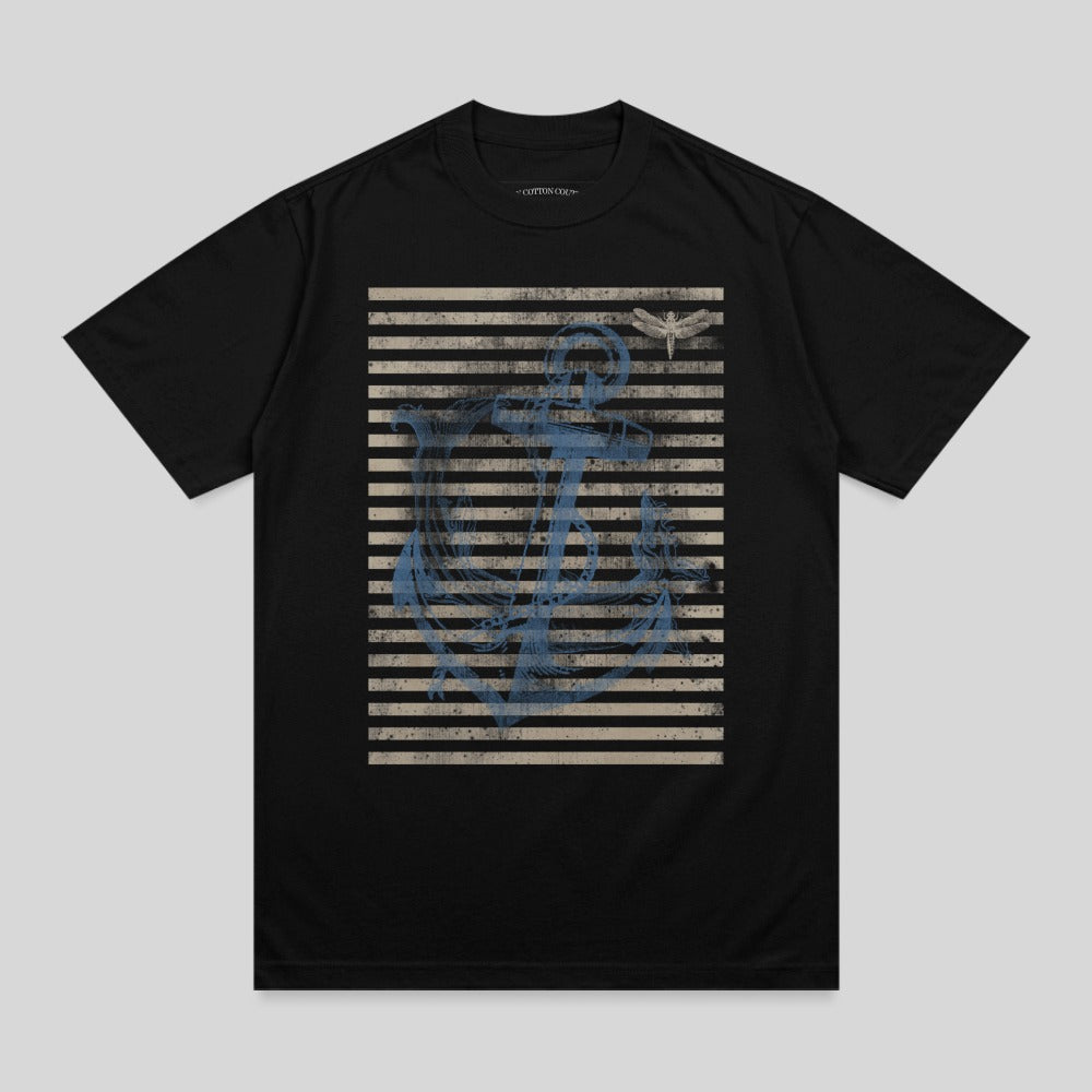 Black t-shirt with distressed blue anchor and dragonfly graphic on striped background.