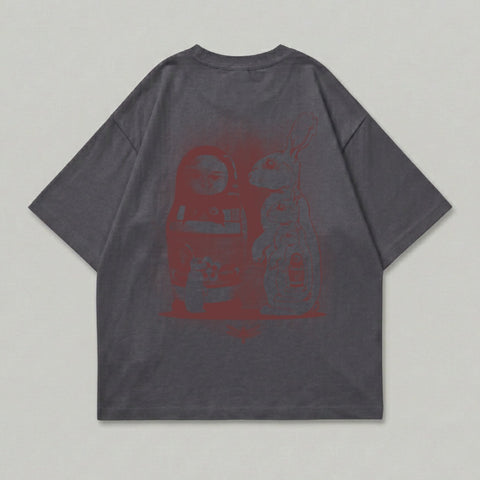 Grey t-shirt with red graphic of a matryoshka doll and a rabbit.
