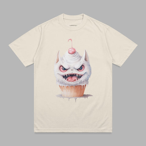 Cream t-shirt with a grinning cartoon monster cupcake graphic.