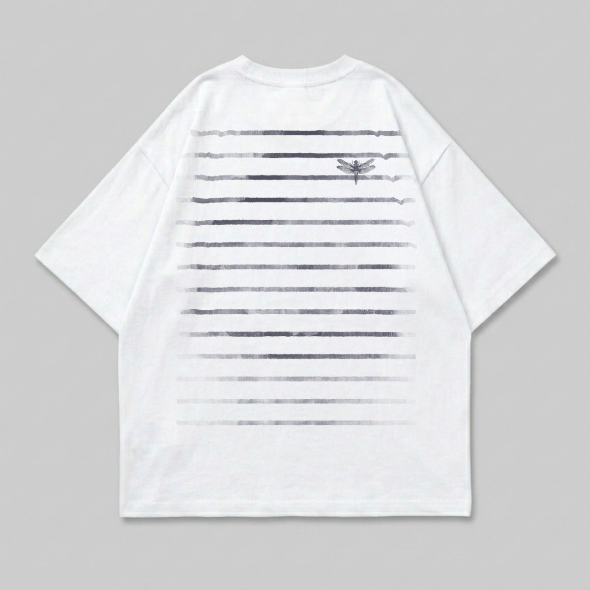 White t-shirt with horizontal gradient stripes and a small dragonfly graphic.