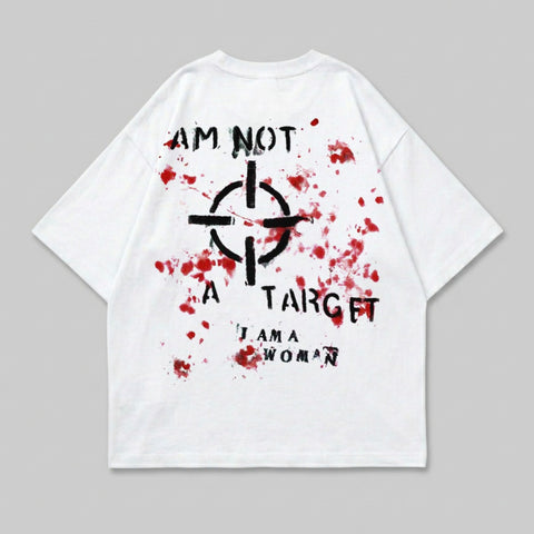White t-shirt with black target graphic and "I AM NOT A TARGET I AM A WOMAN" text.