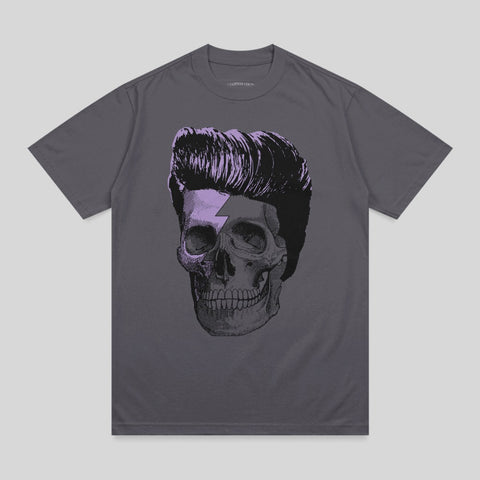Skull with slicked-back hair and a lightning bolt detail on a grey t-shirt.