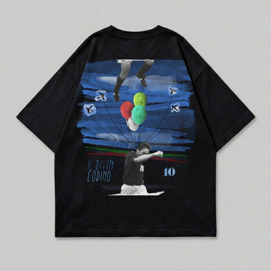 Black t-shirt with graphic art of a soccer player, balloons, and a blue sky.