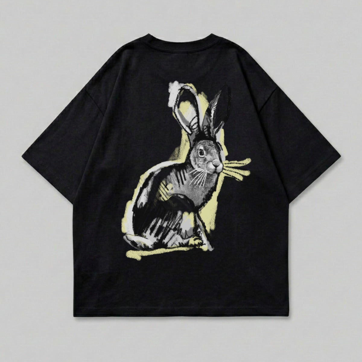 Black t-shirt with a stylized rabbit graphic in yellow and black.