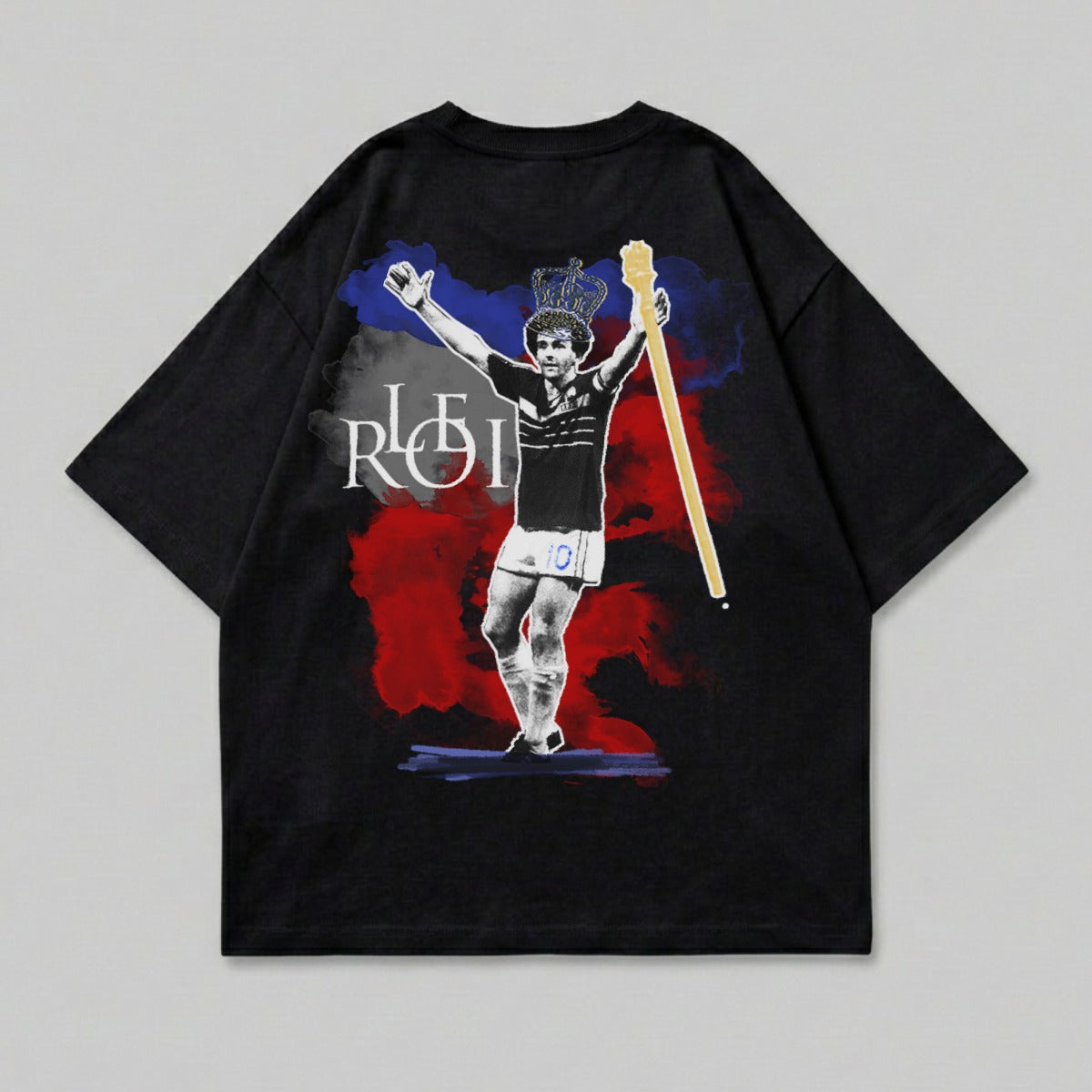Black t-shirt with a graphic of a soccer player wearing a crown and holding a scepter.