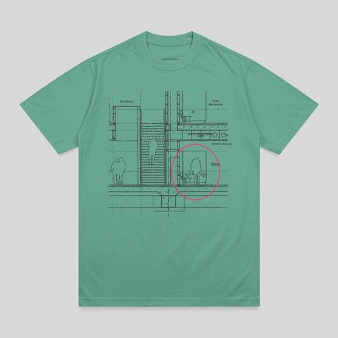 Teal t-shirt with schematic diagram of building interior, including "The Street" and toilet areas.
