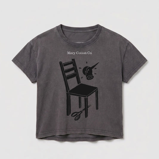 Dark grey t-shirt with a chair, scissors, and watering can graphic.