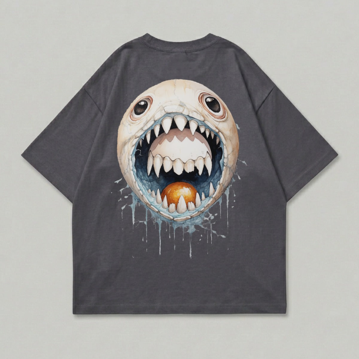 T-shirt with a detailed graphic of a monstrous, open-mouthed egg with sharp teeth.