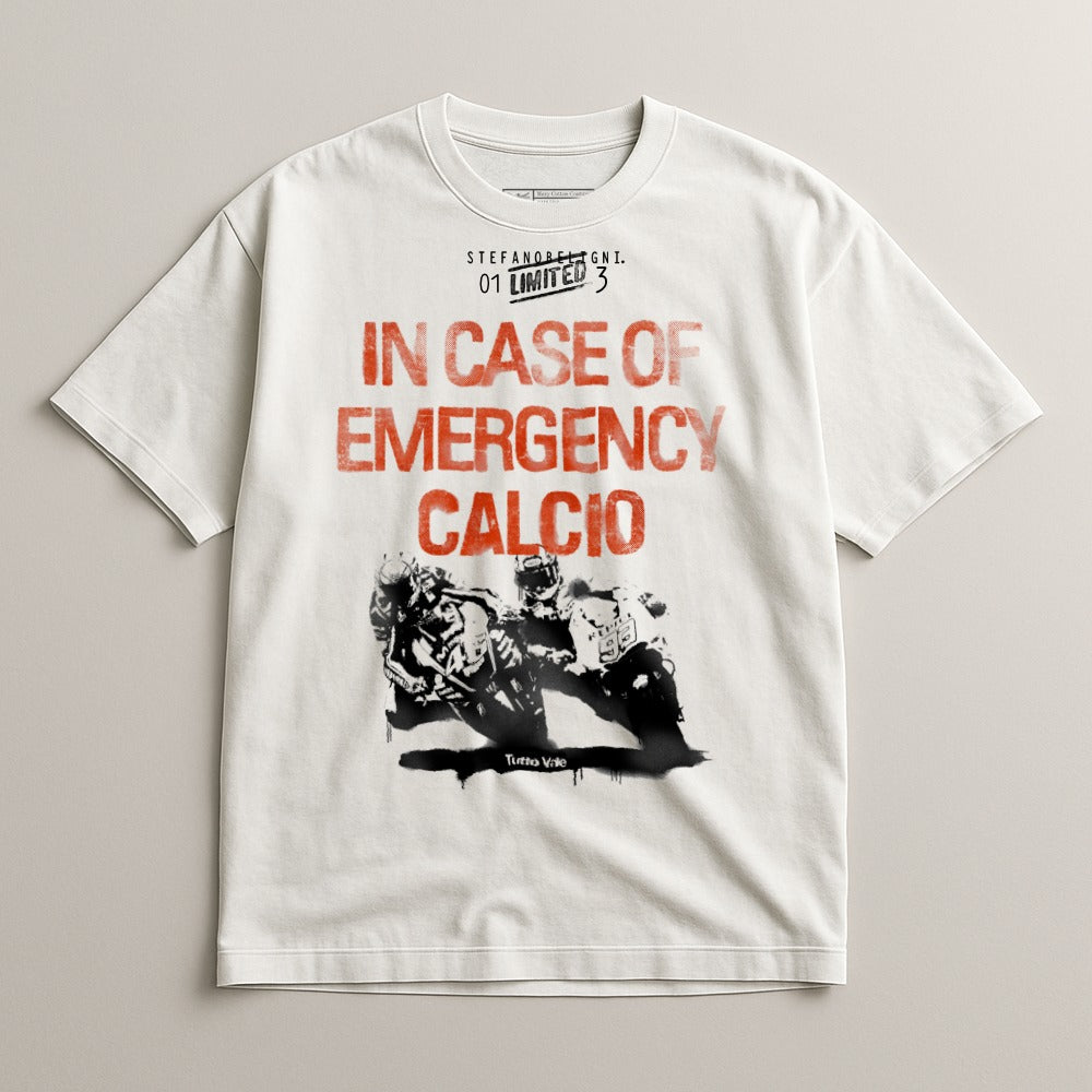 White t-shirt with "IN CASE OF EMERGENCY CALCIO" in red text and a motorcycle racing graphic.