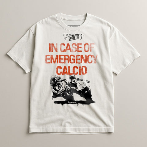 White t-shirt with "IN CASE OF EMERGENCY CALCIO" in red text and a motorcycle racing graphic.