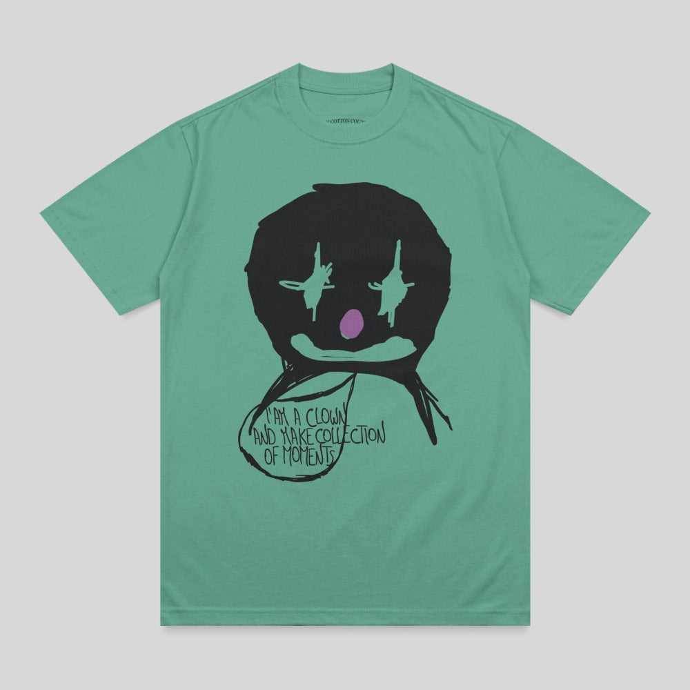T-shirt with a black clown face and purple accents, saying "I am a clown and make collection of moments."