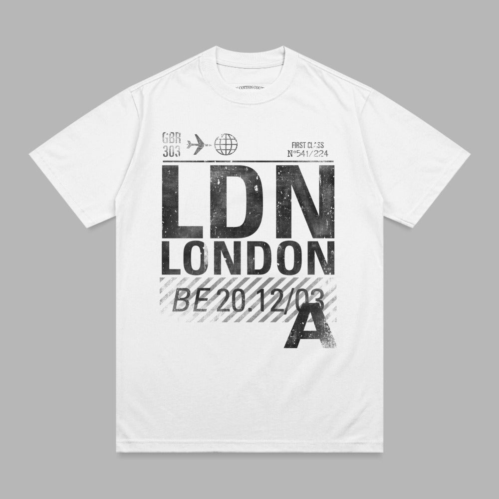 White t-shirt with black "LDN LONDON" airport-style text and flight details.