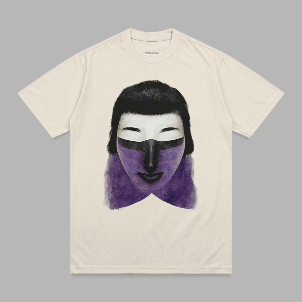 Cream t-shirt with abstract purple and black face mask graphic.