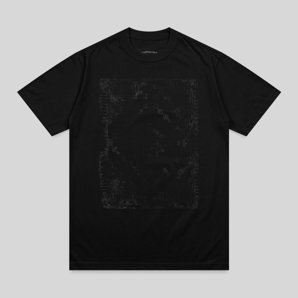 Black t-shirt with faded graphic print and small text at neckline.