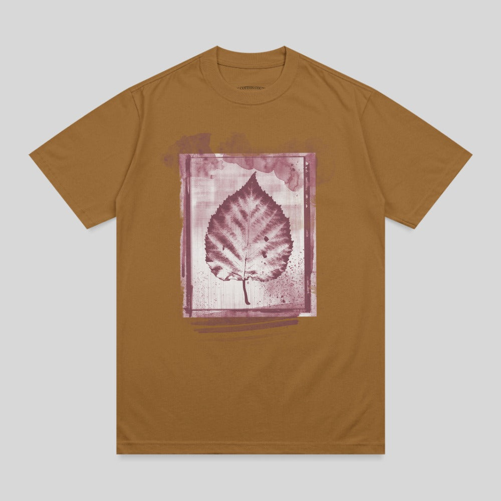 Brown t-shirt with a framed, stylized leaf print.