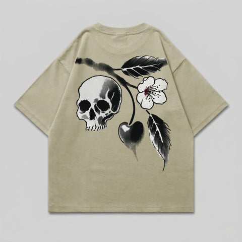 Beige t-shirt with a black ink skull and cherry blossom design.