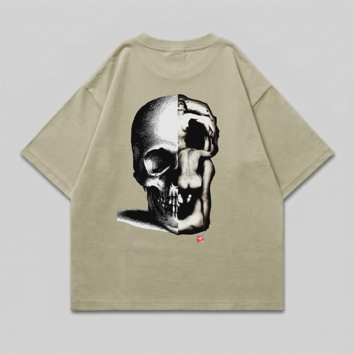 T-shirt with a split skull graphic, half skeletal, half human form.