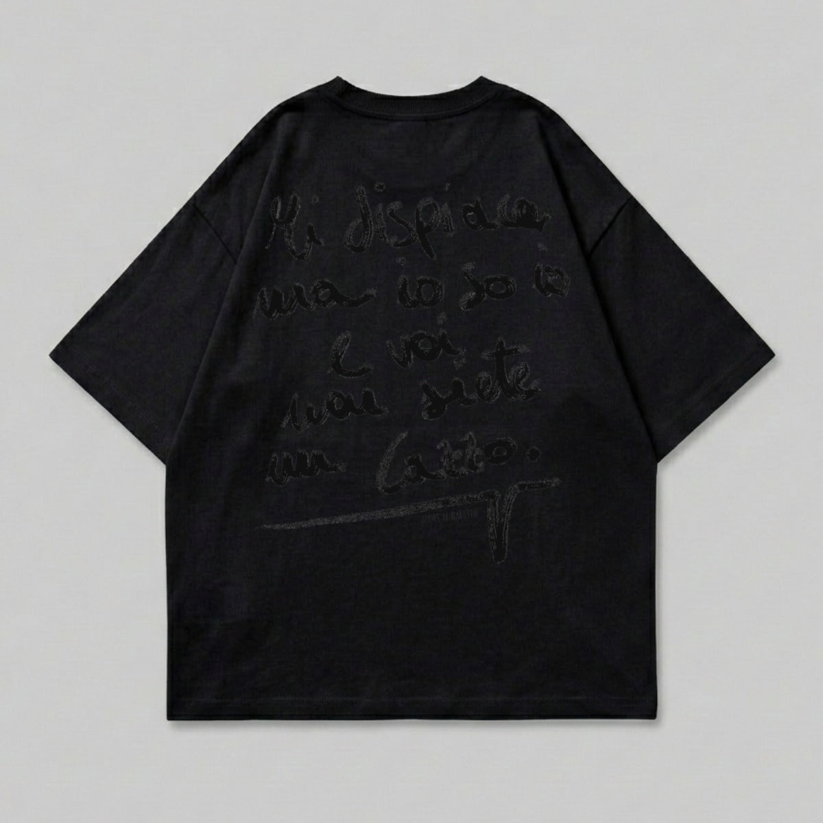 Black t-shirt with handwritten text in Italian on the back.