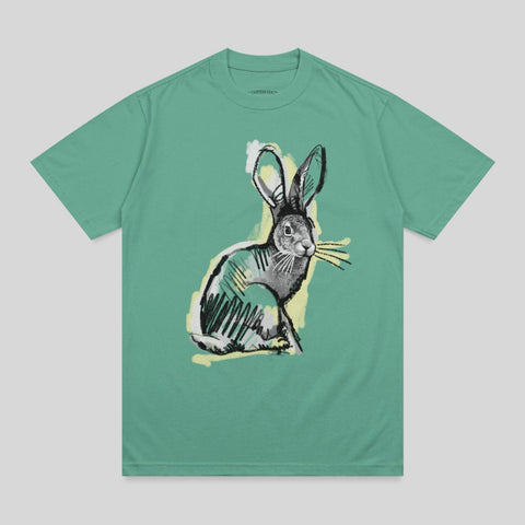 Green t-shirt with a sketchy illustration of a rabbit in black and yellow.