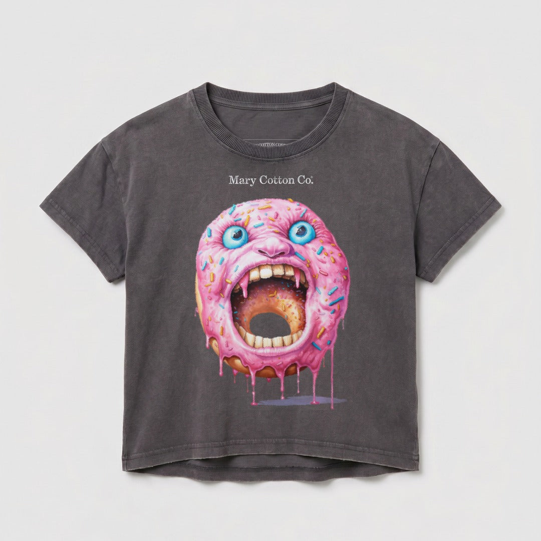T-shirt featuring a pink-frosted donut with a screaming face and blue eyes.