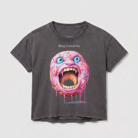 T-shirt featuring a pink-frosted donut with a screaming face and blue eyes.