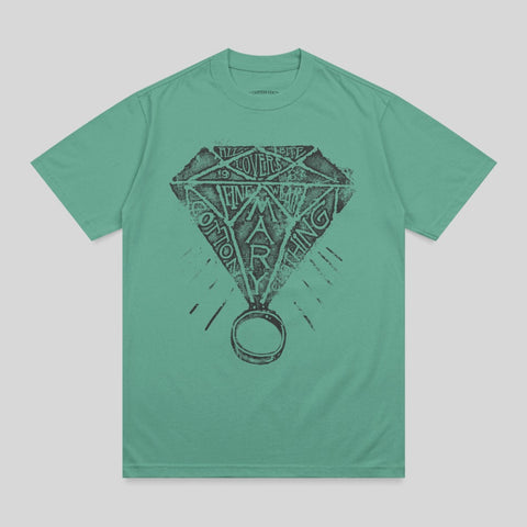 Green t-shirt with diamond ring graphic and text "COTTON MARLING".