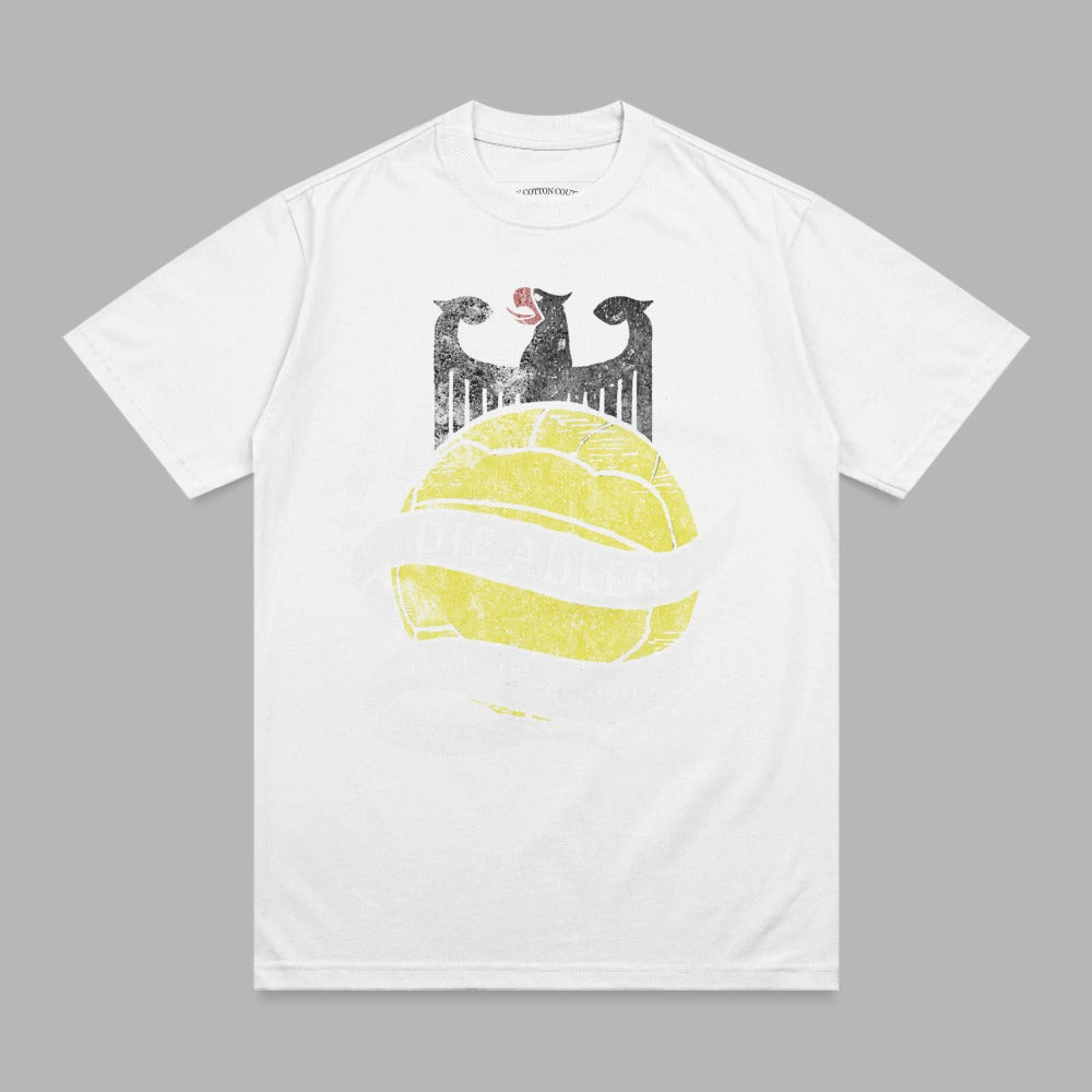White t-shirt with a graphic of a German eagle holding a banner over a yellow soccer ball.