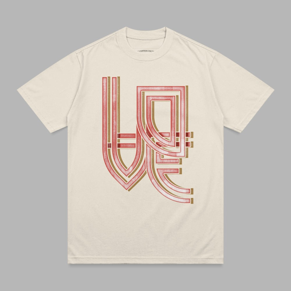 Cream t-shirt with abstract geometric red and gold graphic design.