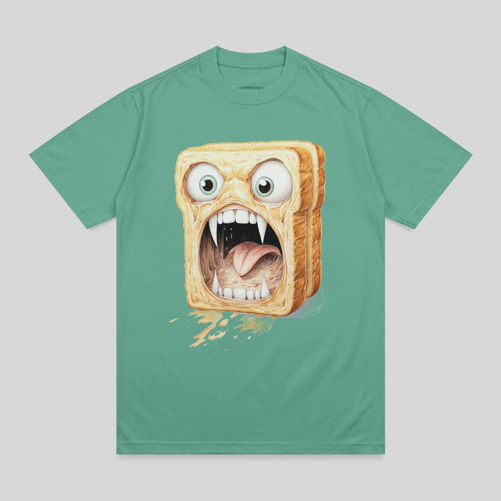 Illustration of a slice of toast with a monstrous face, on a teal t-shirt.