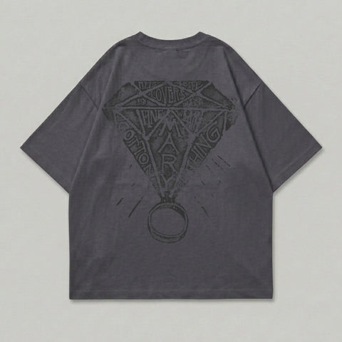 Dark grey t-shirt with diamond graphic and ring on back.