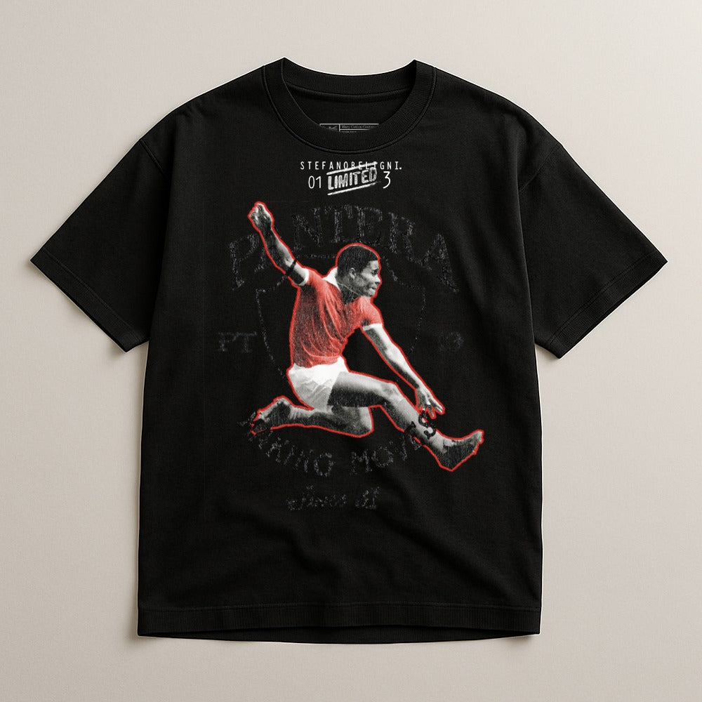 Black t-shirt with graphic of a jumping soccer player in red jersey.