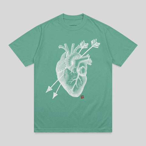 Green t-shirt with a white anatomical heart graphic pierced by two arrows.