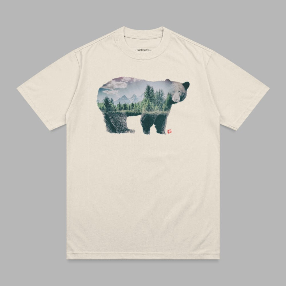 Bear silhouette filled with a forest landscape and mountains.