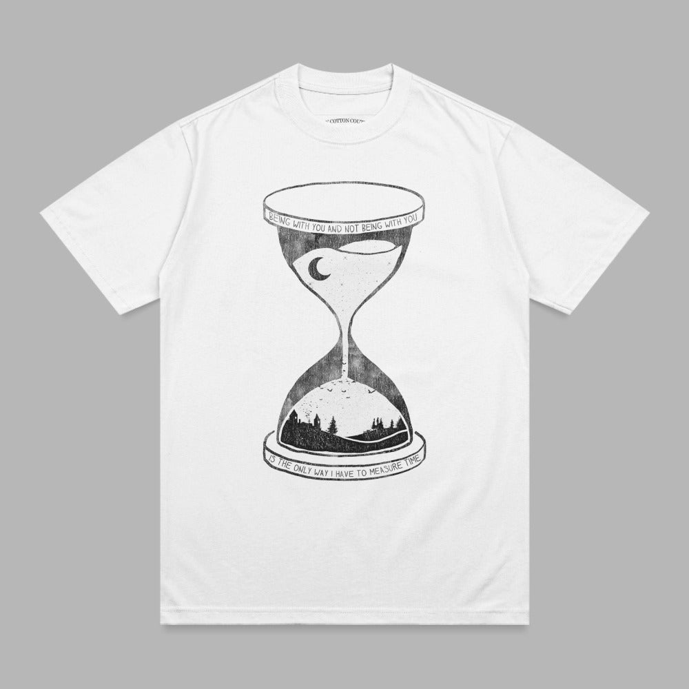White t-shirt with hourglass graphic and quote about time.