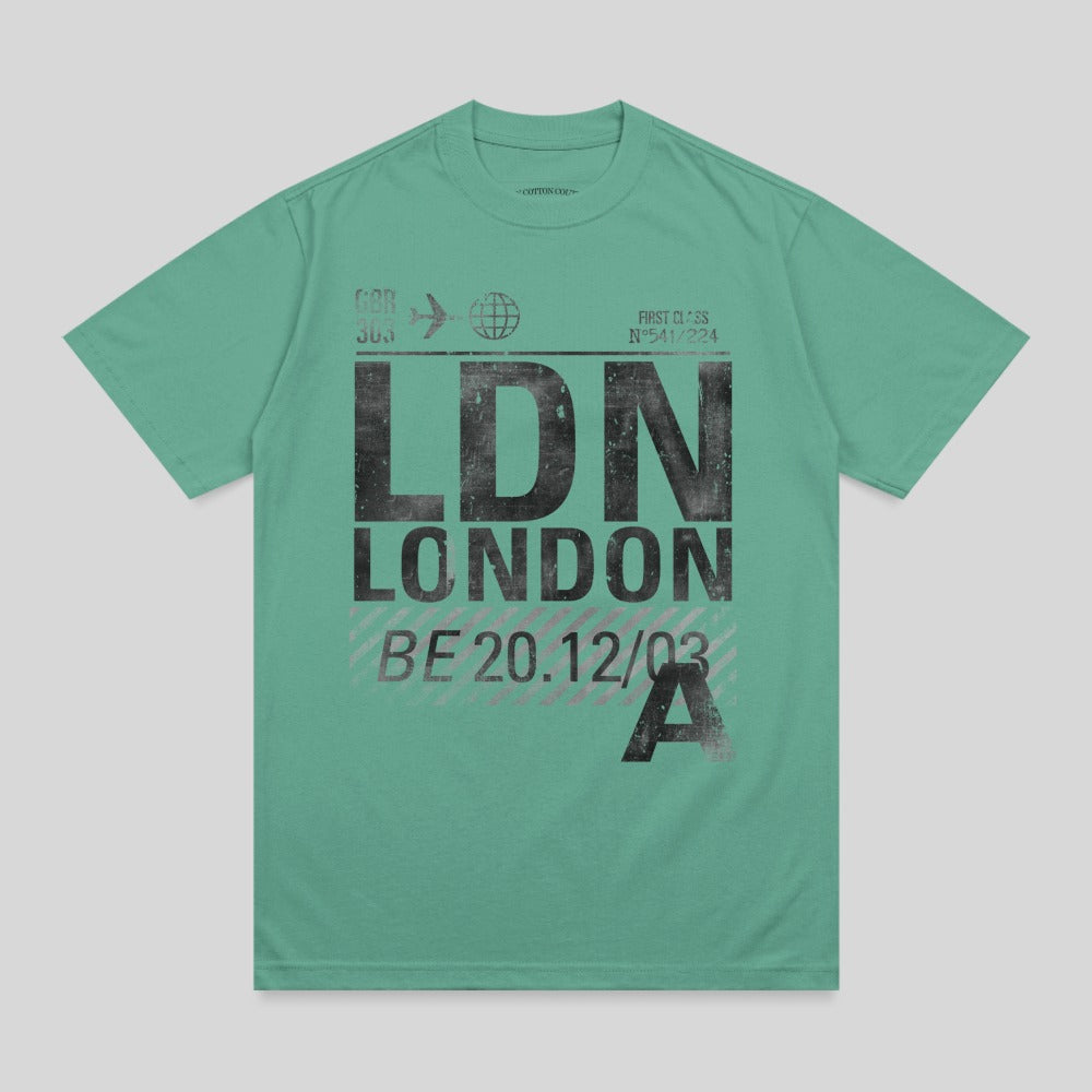 Green t-shirt with "LDN LONDON" and flight information in black.
