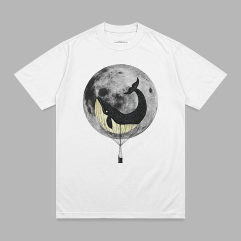 White t-shirt with whale in hot air balloon flying past the moon.