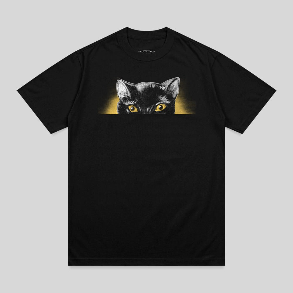 Black t-shirt with a black cat peeking over the top.