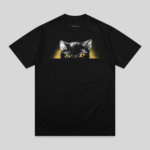 Black t-shirt with a black cat peeking over the top.