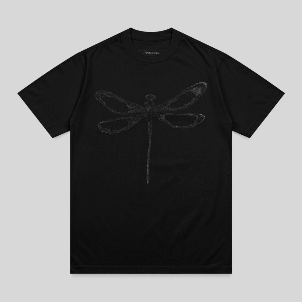 Black t-shirt with a tonal gray dragonfly graphic and text at collar.