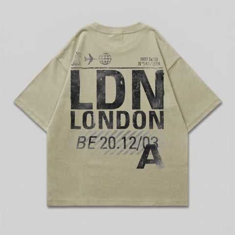 T-shirt with "LDN LONDON" and flight information in distressed black text.