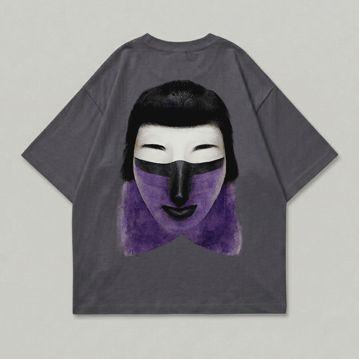 Dark grey t-shirt with a graphic of a stylized face with purple paint and black hair.