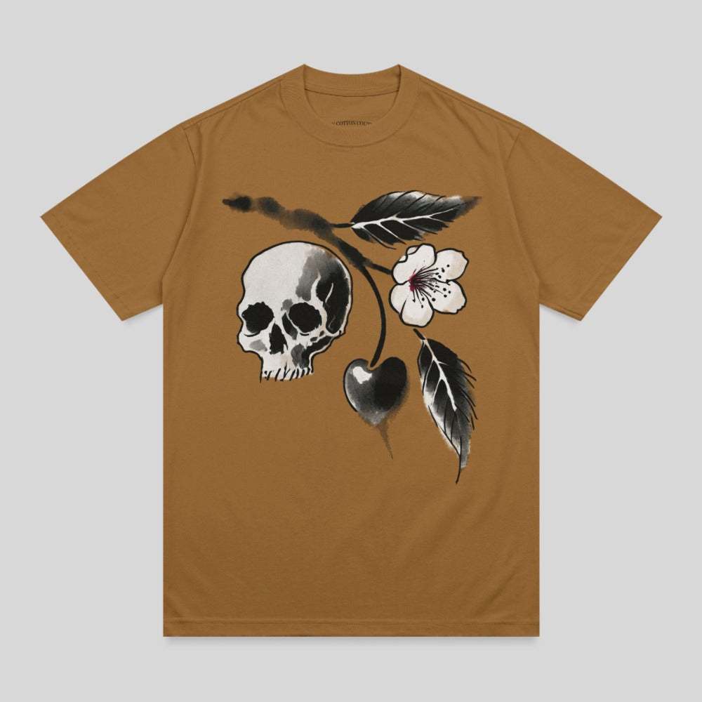 Brown t-shirt with a black and white skull, cherry, and floral branch design.